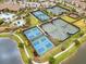 Overhead view of the community's plentiful tennis and pickleball courts near the clubhouse at 11127 Devonbridge Dr, Palmetto, FL 34221