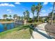 Picturesque community with a beautiful water feature, lush landscaping and inviting walking path at 11127 Devonbridge Dr, Palmetto, FL 34221