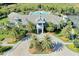 Stunning aerial view of the community clubhouse, pool, and meticulously manicured landscaping at 12370 Marsh Pointe Rd, Sarasota, FL 34238