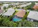 Beautiful home with a screened-in pool area, lush landscaping and a tile roof in a lovely neighborhood at 12370 Marsh Pointe Rd, Sarasota, FL 34238