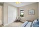 Small bedroom featuring a twin bed, closet, and a window with natural light at 12370 Marsh Pointe Rd, Sarasota, FL 34238