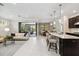 Spacious and open living space with a seamless transition between the kitchen, dining, and living room areas at 12370 Marsh Pointe Rd, Sarasota, FL 34238