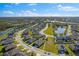 Aerial view of the property, showcasing its location within a community with ponds and green spaces at 13065 Bliss Loop, Bradenton, FL 34211