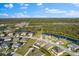 Scenic aerial view of the property in a community near ponds, lakes, and natural wooded areas at 13065 Bliss Loop, Bradenton, FL 34211