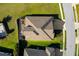 Overhead view of a home with a neatly kept roof and a driveway leading to the street at 13065 Bliss Loop, Bradenton, FL 34211