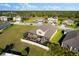 Aerial view of a home featuring a screened-in lanai with outdoor furniture and a spacious backyard at 13065 Bliss Loop, Bradenton, FL 34211