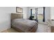 Bedroom featuring wood-look flooring, light walls, a desk and backyard views at 13065 Bliss Loop, Bradenton, FL 34211