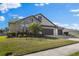 Charming two-story home with a three car garage and lush landscaping at 13065 Bliss Loop, Bradenton, FL 34211
