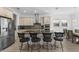 Well-equipped kitchen features a large island, stainless steel appliances, and bar seating at 13065 Bliss Loop, Bradenton, FL 34211