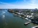 Beautiful aerial view of a waterfront property with a dock and beach at 1374 Moonmist Dr # B1, Sarasota, FL 34242