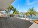 Back porch with chairs overlooking a boat dock and waterfront at 1374 Moonmist Dr # B1, Sarasota, FL 34242