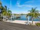 Back porch of waterfront property with a boat dock and tropical landscaping at 1374 Moonmist Dr # B1, Sarasota, FL 34242