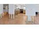 Open-concept kitchen area ready for a remodel with tile flooring, exposed studs and unfinished walls at 1374 Moonmist Dr # B1, Sarasota, FL 34242