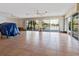 Bright and airy living room featuring large windows with beautiful water views and tile flooring at 1374 Moonmist Dr # B1, Sarasota, FL 34242