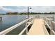 Chairs line the waterfront on a sunny day with calm waters and waterfront homes at 1374 Moonmist Dr # B1, Sarasota, FL 34242