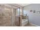 Modern bathroom featuring a separate shower and tub with tile surround at 15008 Trinity Fall Way, Bradenton, FL 34212