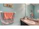 Well-lit bathroom with granite countertop vanity and modern fixtures at 15008 Trinity Fall Way, Bradenton, FL 34212