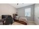 Comfortable bedroom features a bed with storage and a ceiling fan at 15008 Trinity Fall Way, Bradenton, FL 34212