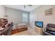 Cozy bedroom features a twin bed, ceiling fan, and a closet at 15008 Trinity Fall Way, Bradenton, FL 34212