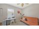 Bright room featuring a daybed, workspace, and plenty of natural light at 15008 Trinity Fall Way, Bradenton, FL 34212