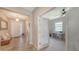 Bright foyer leading to an office featuring a frosted glass door and a spacious entryway at 15008 Trinity Fall Way, Bradenton, FL 34212