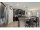 Modern kitchen featuring granite countertops, stainless steel appliances, and dark wood cabinetry at 15008 Trinity Fall Way, Bradenton, FL 34212