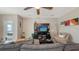 Cozy living room with comfortable seating, and an entertainment center at 15008 Trinity Fall Way, Bradenton, FL 34212