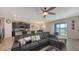 Spacious living room with water view, large sectional, breakfast bar and modern kitchen at 15008 Trinity Fall Way, Bradenton, FL 34212