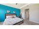 Relaxing primary bedroom with accent wall, soft carpet, and convenient ensuite access at 15008 Trinity Fall Way, Bradenton, FL 34212