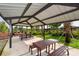 Covered picnic tables in a neighborhood area with grassy areas and sidewalks at 15008 Trinity Fall Way, Bradenton, FL 34212