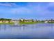 Community pond with fountains and lush landscaping surrounding the neighborhood clubhouse at 15008 Trinity Fall Way, Bradenton, FL 34212