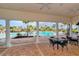 Community pool with large deck, covered seating and sun loungers at 15008 Trinity Fall Way, Bradenton, FL 34212