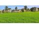 Community soccer field for residents with lush green grass and bench for relaxing at 15008 Trinity Fall Way, Bradenton, FL 34212