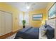 Bedroom featuring neutral paint, an area rug, and white plantation shutters at 1663 San Silvestro Dr, Venice, FL 34285