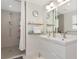 Bright bathroom with walk-in shower, double vanity, and modern fixtures at 1990 Main St # 10, Sarasota, FL 34236