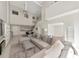 Bright, open living room boasts high ceilings, modern furnishings, eat-in kitchen, and loft at 1990 Main St # 10, Sarasota, FL 34236