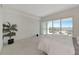 Bedroom with a view, tile floor, and minimalist decor and big windows at 1990 Main St # 10, Sarasota, FL 34236
