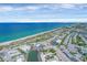 Birds eye view of a coastal community with ocean, beachfront, and local businesses at 2350 N Beach Rd # 1A, Englewood, FL 34223