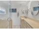 Modern bathroom with a glass-enclosed shower and double vanity with ample storage at 2350 N Beach Rd # 1A, Englewood, FL 34223