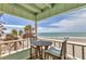 Enjoy beautiful beach views from this covered deck with an outdoor dining set at 2350 N Beach Rd # 1A, Englewood, FL 34223