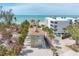 Charming beach house with palm trees, located near a white sandy beach and beautiful ocean views at 2350 N Beach Rd # 1A, Englewood, FL 34223