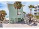 Quaint beach cottage steps from the sand, complete with outdoor stairs and charming details at 2350 N Beach Rd # 1A, Englewood, FL 34223