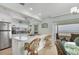 Open kitchen featuring a breakfast bar, stainless steel appliances, and a view of the ocean at 2350 N Beach Rd # 1A, Englewood, FL 34223