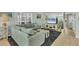 Comfortable living room with plush sofa, contemporary decor, and bright lighting at 2350 N Beach Rd # 1A, Englewood, FL 34223