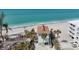 Breathtaking aerial view of a home on a pristine beach with turquoise water at 2350 N Beach Rd # 1B, Englewood, FL 34223