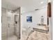 Modern bathroom featuring a glass-enclosed shower and granite countertops at 2350 N Beach Rd # 1B, Englewood, FL 34223