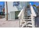 Staircase view of a elevated beach house with outdoor access at 2350 N Beach Rd # 1B, Englewood, FL 34223