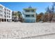 Beachfront home with balconies and white picket fencing near the ocean at 2350 N Beach Rd # 1B, Englewood, FL 34223