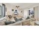 Spacious living room with comfortable seating, plenty of natural light, and access to other rooms at 2350 N Beach Rd # 1B, Englewood, FL 34223