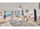 Stylish living room with comfortable sofa, modern decor, and ocean view at 2350 N Beach Rd # 1B, Englewood, FL 34223